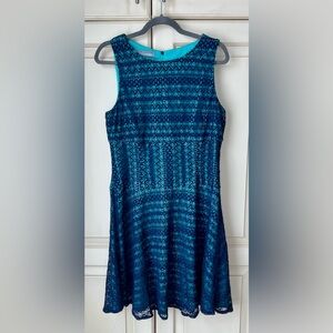 Maggy London for Melanie Lynn Turquoise dress with lace overlay. M/L